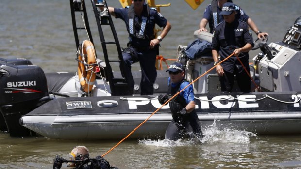 Police divers search the waters surrounding the venue of the annual G20 leaders summit in Brisbane.
