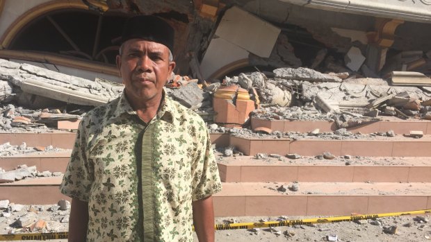 Abdul Hanan outside the ruins of his Islamic school and cultural centre in the village of Ulee Gle. 