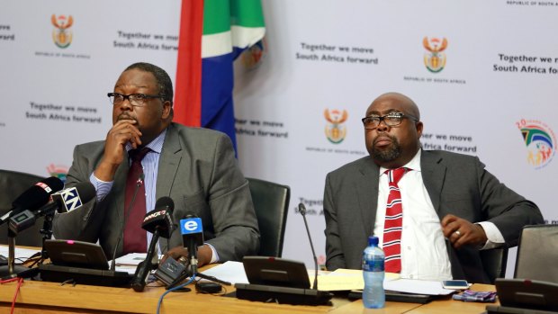 South African Police Minister Nathi Nhleko (left) and Public Works Minister Thulas Nxesi brief the media on the president's Nkandla homestead project on May 28.