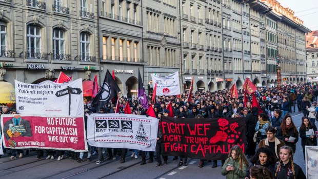 Protesters in Bern, Switzerland, demonstrate against the World Economic Forum and US President Donald Trump's visit.