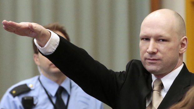 Breivik makes a Nazi salute as he enters a courtroom.