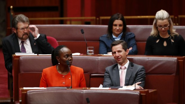 Deal done: Education Minister Simon Birmingham with crossbenchers Derryn Hinch, Lucy Gichuhi, Jacqui Lambie and Skye Kakoschke-Moore.