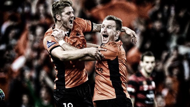 That special feeling: Luke Brattan and Besart Berisha of the Brisbane Roar celebrate victory as the full-time siren sounds in the 2014 A-League grand final against the Western Sydney Wanderers.