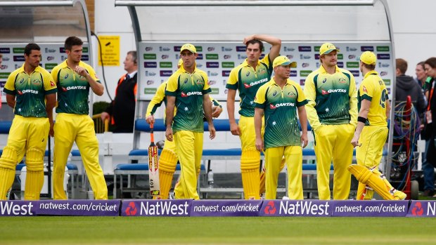 The Australian team look dejected after their loss to England.
