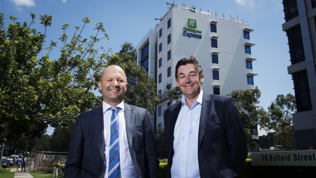 IHG director of development Matt Tripolone, left, with managing director of Pro-Invest Phil Kasselis at the front of the new Holiday Inn Express.