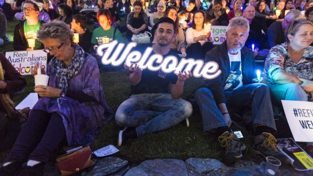 Thousands of people joined a candlelight vigil in Brisbane to show solidarity and welcome for Syrian refugees.