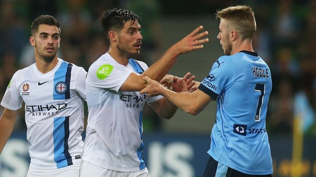 Bruno Fornaroli of Melbourne City and Andrew Hoole of Sydney FC have an argument during the game.