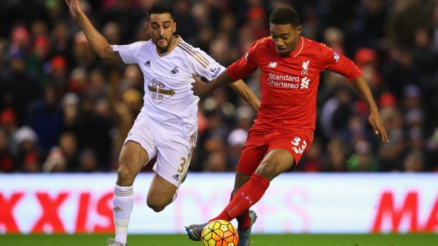 Contest: Jordon Ibe of Liverpool takes on Neil Taylor of Swansea City.