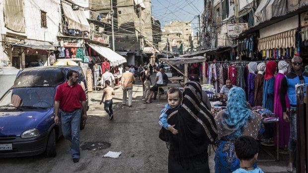 A market in the Shatila refugee camp near Beirut. A new wave of refugees from Syria and its civil war has swollen the population of Lebanon's 12 official Palestinian refugee camps.