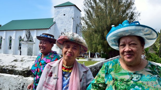 Women coming out of church after a Sunday service.The dominant religion in the Cook Islands is Christianity. The first missionaries arrived in 1821.