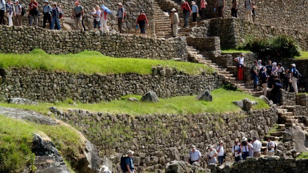 Crowds visit the ancient ruins at Machu Picchu near Cusco in Peru.