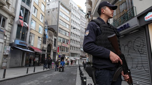 Police secure the area following a suicide bombing in a major shopping and tourist district in the central part of Instanbul