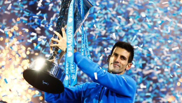 Unstoppable: Novak Djokovic lifts the trophy following his victory during the men's singles final against Roger Federer of Switzerland on day eight of the Barclays ATP World Tour Finals at the O2 Arena on November 22 in London.