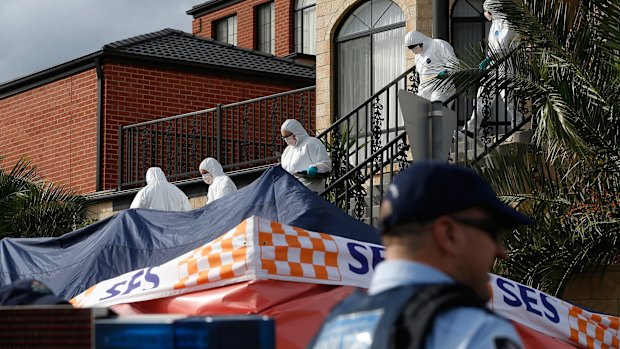 Police leave a Melbourne house which was raided as part of a counter terrorism operation.