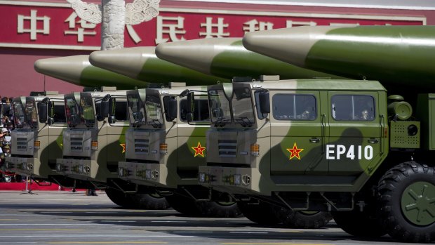 Military vehicles carrying DF-26 ballistic missiles drive past Tiananmen Gate during a military parade in Beijing to commemorate the 70th anniversary of the end of World War II.