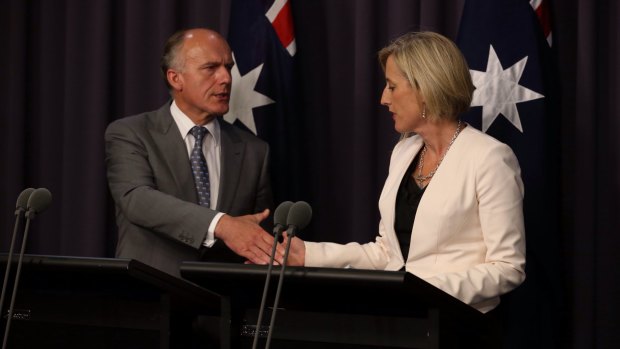 Deal: Employment Minister Eric Abetz and ACT Chief Minister Katy Gallagher agree to a Commonwealth loan of 1 billion for the demolition of asbestos filled houses in Canberra.
