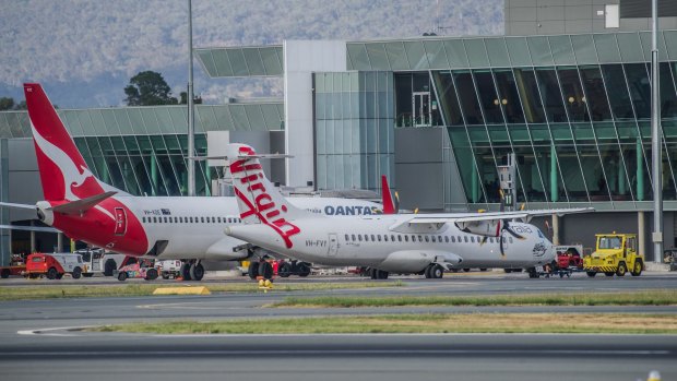 Qantas and Virgin aircraft at Canberra International Airport. ACT Chief Minister Andrew Barr says he wants to see direct flights between Canberra and Hobart.