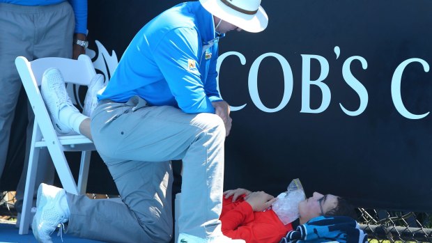 A ballboy faints at last year's Australian Open during a heatwave.
