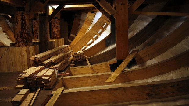 Wood planks sit inside the Noah's ark replica.