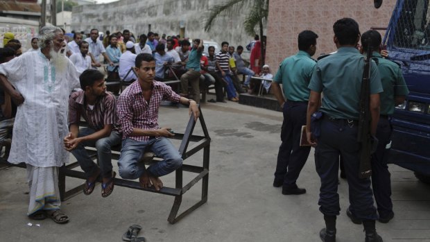 Relatives wait to meet prisoners outside the Dhaka Central jail on Sunday. 