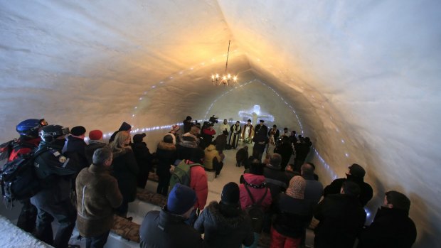 A group of priests of various congregations hold an inaugural mass for a church made entirely from ice in Romania.
