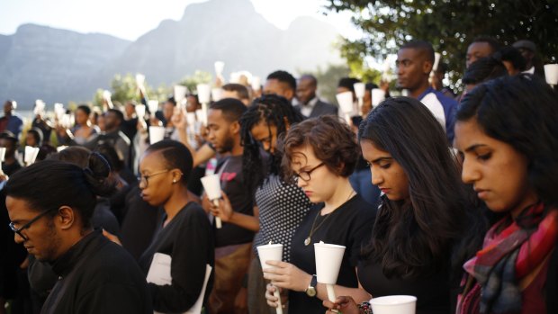 Students attend a vigil for victims of the Kenyan university massacre at the University of Cape Town in South Africa.