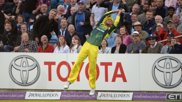 One of the best grabs ever ... Glenn Maxwell catches out Liam Plunkett of England before throwing the ball into the air, stepping over the boundary line and catching him again on the field.