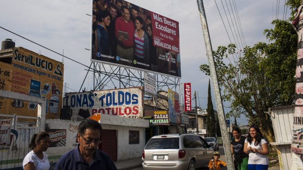 A billboard for the campaign of Indalecio Rios, the mayoral candidate in Ecatepec de Morelos, Mexico from President Enrique Pena Nieto's Institutional Revolutionary Party.