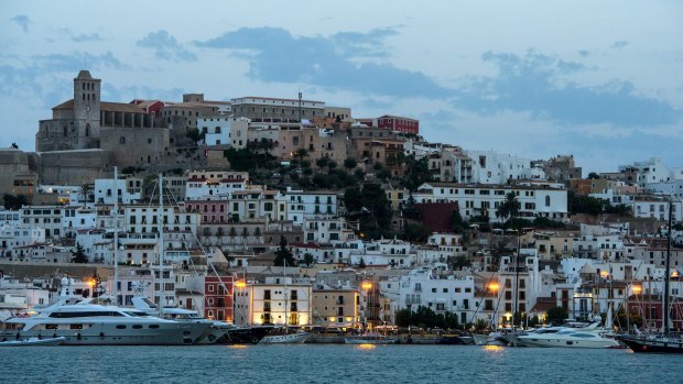 The woman was visiting her boyfriend at Ibiza when she fell to her death from a cliff, police say. 