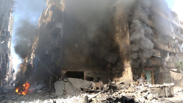 Smoke rises from an Aleppo building after a Russian jet carried out an air strike.
