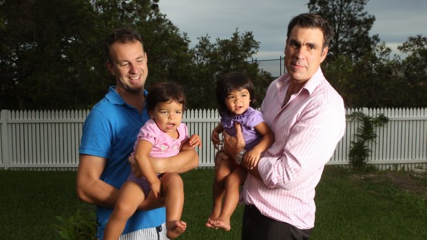 Philip Copland and Sam Everingham with Zoe and Ruby in 2013.