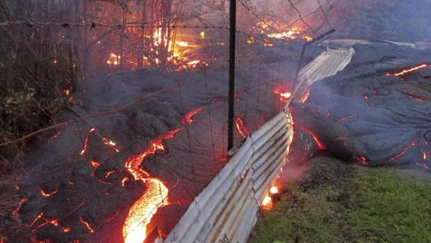 A fence won't cut it: Lava flows from the Kilauea volcano onto properties in Hawaii. 