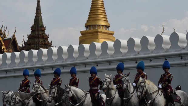 Palace guards outside the Grand Palace in Bangkok waiting for the body of Thailand's King Bhumibol Adulyadej on Friday.
