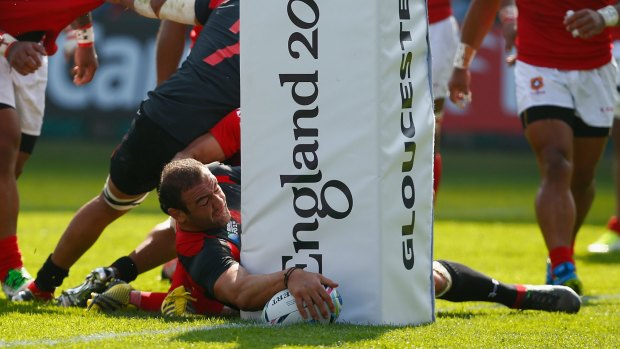 Georgia captain Mamuka Gorgodze scores his team's first try against Argentina.