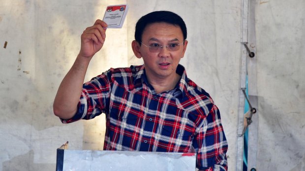 Jakarta's governor Basuki "Ahok" Tjahaja Purnama casts his ballot on Wednesday.