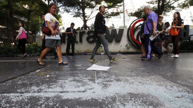 People walk past the site of Monday's bombing in central Bangkok.