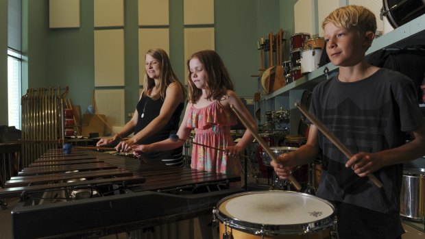 Canberra Symphony Orchestra's principal percussionist Veronica Baily with Amalie Leslie and Matthew Forster, who have limited hearing and are on the Cochlear Percussion Scholarship.