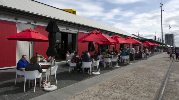 Cafe culture by shipping containers at Viaduct Harbour, Auckland.