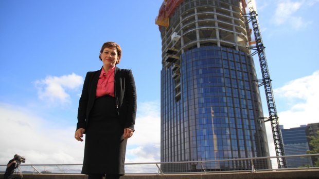 Deputy Premier Jackie Trad pictured at the "tower of power", where gaskets used on its construction were found to be contaminated with asbestos.