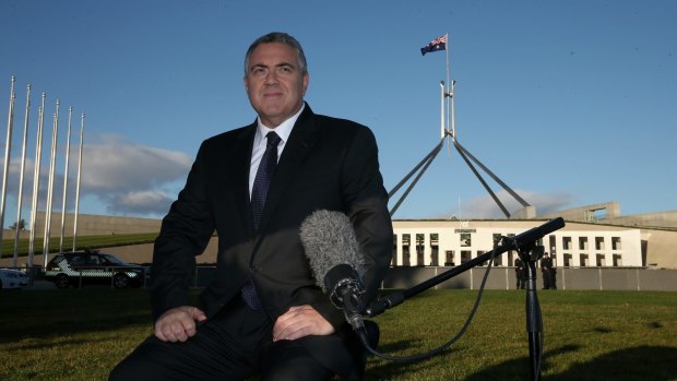 Treasurer Joe Hockey in between breakfast tv interviews on the front lawn of Parliament House in Canberra on Wednesday 13 May 2015. Photo: Alex Ellinghausen