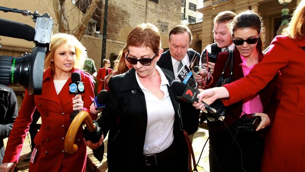 Roger Rogerson's wife, Anne Melocco, leaving Central Local Court after he is refused bail. 