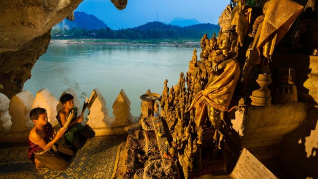 Pak Ou caves with 2500 buddha statues in Luang Prabang province, Laos.