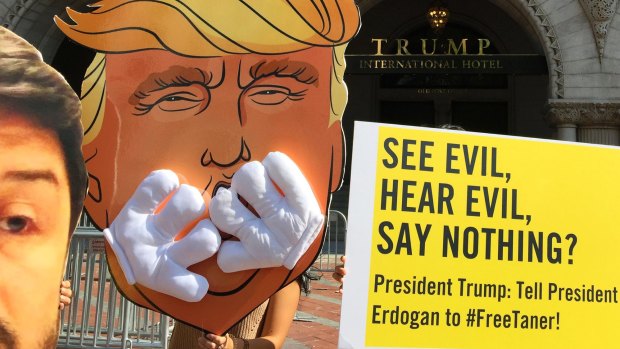 Members of Amnesty International demonstrate outside Trump International Hotel in Washington, in  June.