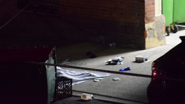 A man's body lies covered with a blanket in Dath St, Teneriffe.