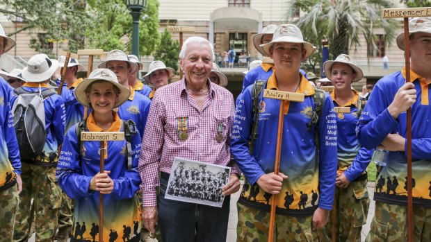 Henry Anstey Jr, whose father Henry Anstey marched as an original Dungaree in 1915, pictured next to Adam Sayers, 14, from 13 ACU Toowoomba who carried Henry Anstey's name during the re-enactment.