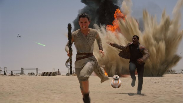 Under attack: Daisy Ridley as Rey, left, and John Boyega as Finn in <i>Star Wars: The Force Awakens</i>.