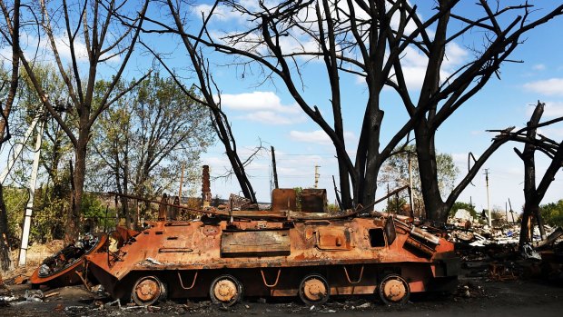 A destroyed armoured vehicle from a battle outside of the battered city of Luhansk on September 13.