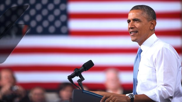 Jacketless, sleeves rolled up, Obama again defies political convention - even while at one.