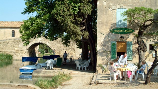 Canal du Midi at Le Someil, a 17th-century port with an 18th-century stone bridge.