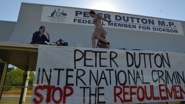Protesters who climbed onto the awning of Immigration Minister Peter Dutton's office have been fined.